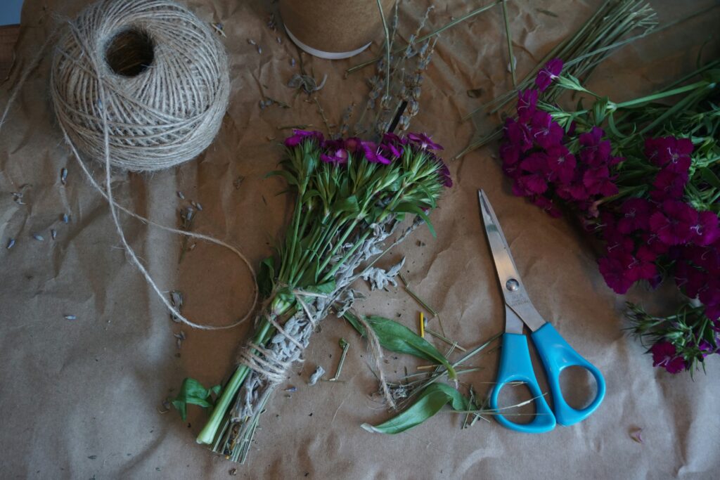 a bundle of purple flowers tied with string